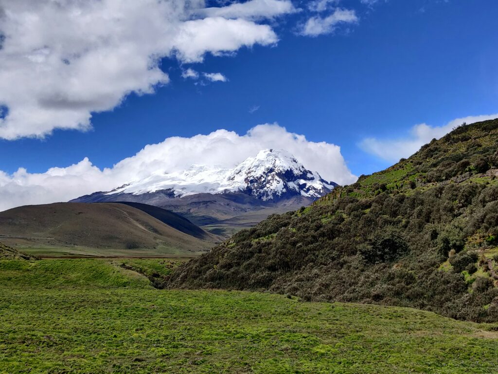 Snow-covered Antisana volcano and Andean landscape